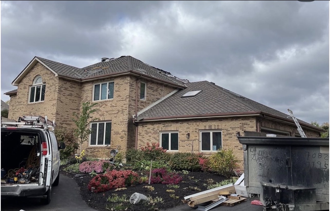Brick home with a fully finished roof and restored exterior