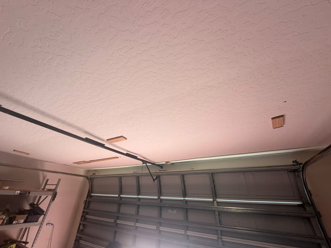 Finished garage ceiling with matched spray texture